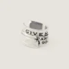 Kolczyk typu earcuff Givenchy Tape z metalu i emalii Kolczyk typu earcuff Givenchy Tape z metalu i emalii