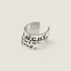 Kolczyk typu earcuff Givenchy Tape z metalu i emalii Kolczyk typu earcuff Givenchy Tape z metalu i emalii