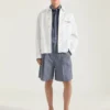 Kurtka z haftowanym napisem „Givenchy Paris” z dżinsu z szwami w stylu couture Kurtka z haftowanym napisem „Givenchy Paris” z dżinsu z szwami w stylu couture